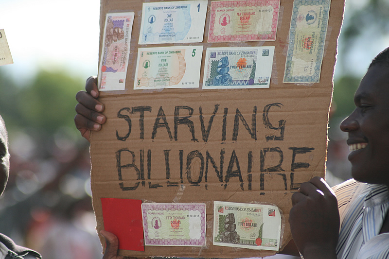 A 'starving billionaire' holding worthless currency notes